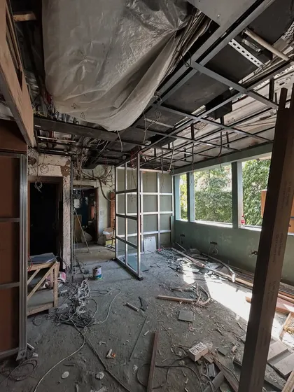 Another view of a site in progress, showing the metal framework for walls and ceilings being installed. This is the skeleton upon which the final design is built.