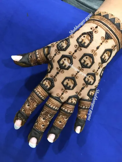 A unique back-of-hand design featuring a pattern of small, interconnected elephants. This creates a beautiful and intricate net-like effect.