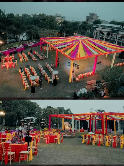 An aerial view of the sprawling Sangeet setup on the lawns of Ramada Udaipur, showcasing the colorful canopy and seating arrangement.