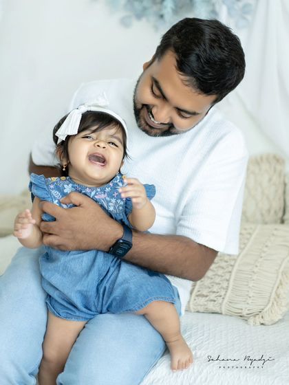 A father and daughter share a laugh. These candid, joyful moments are my favorite to capture.