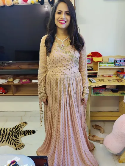 A full-length shot of my client Mansi, looking elegant and ready for her event. The soft pink gown is paired with a simple yet polished makeup look and hairstyle.