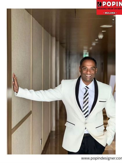 Here is a happy client looking sharp in the same white tuxedo. It’s great to see how our rental pieces look just as good at a real event as they do in a studio.