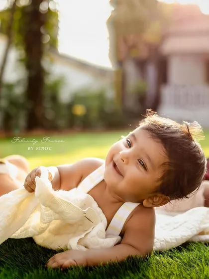 A sweet baby boy enjoying the outdoors, with a beautiful, happy expression.