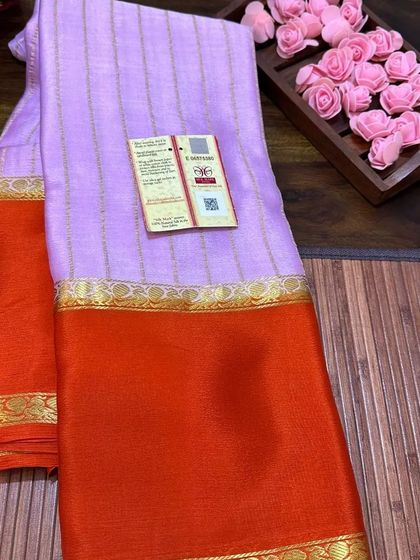 A close-up of the Silk Mark certification on a lavender and orange wrinkle crepe Mysore silk saree.