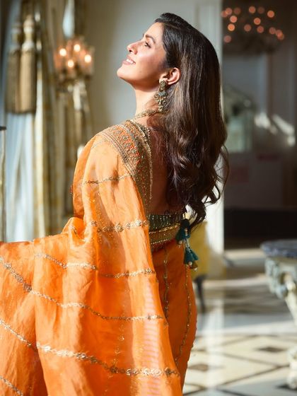 A beautiful profile of Nimrat Kaur. The makeup was designed to look radiant and natural, enhancing her classic beauty.