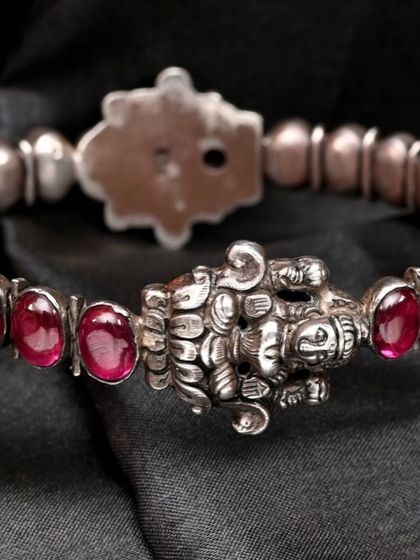 The reverse side of the goddess Lakshmi bracelet, showing the construction and finish of the handcrafted silver piece.