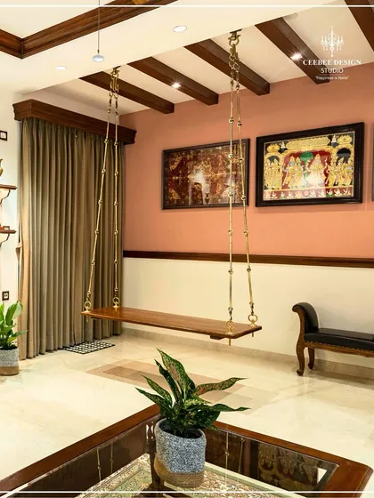 A close-up of the traditional wooden swing (jhula) in the Kerala-style living room, a signature element in my designs.