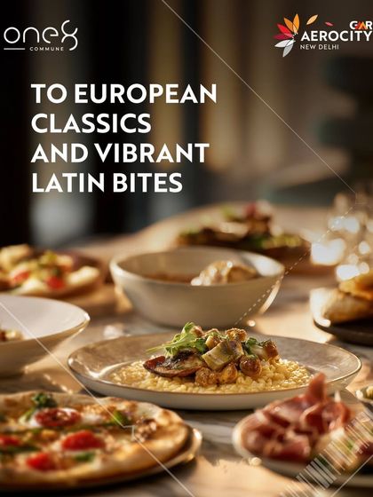 A table at one8 Commune, laden with European classics and vibrant Latin bites. This image shows a variety of dishes, including artisanal pizza and risotto, perfect for a shared dining experience with friends or family.