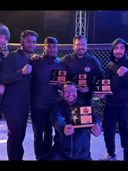 Our team of coaches and officials proudly displaying their awards after the Elite Combat event.