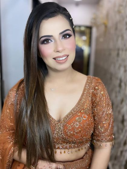 A soft and pretty party makeup look done by my talented team. We focus on a subtle smokey eye and a fresh, dewy base that is perfect for any family function or event.