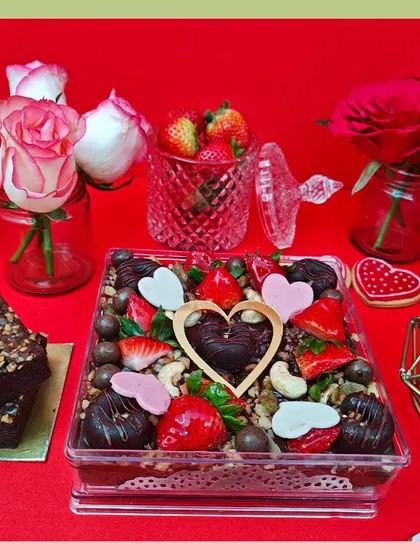 Our Valentine's brownie box is the ultimate decadent treat for your loved one. It's packed with fudgy, rich brownies and generously topped with fresh strawberries, nuts, and chocolate hearts for an extra touch of romance.