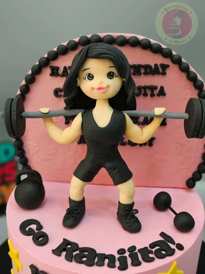 A close-up of the powerful weightlifter figurine, showing her strength and determination. This was for a professional athlete who represents India.