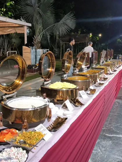A view of our dinner buffet, including salads, raita, and multiple main courses. We ensure a balanced and complete menu for every meal we serve.