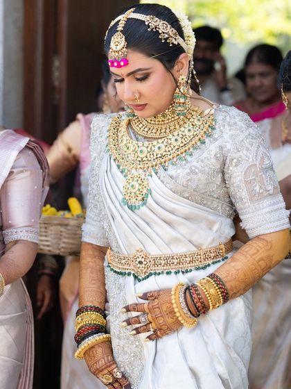 A candid shot of the bride during her wedding, where the rich mehendi stain is beautifully visible, adding to her overall bridal glow.