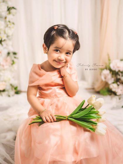 Creating memories stitched with love. This enchanting mother-daughter duo, Meghana and her little one, are twinning in elegant peach organza gowns I designed for their special Mother's Day photoshoot.