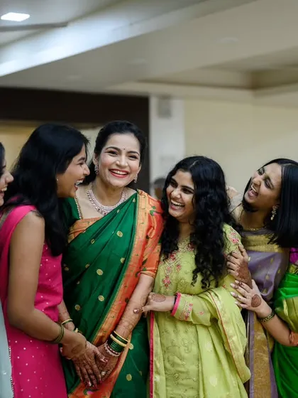 A bride surrounded by her best friends, sharing a laugh. These are the moments that matter. This photo from Sanika's wedding is a perfect ode to friendship and the joy they bring to a wedding.