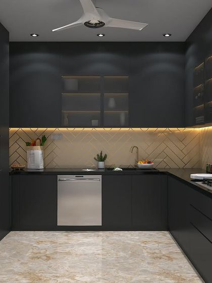 Another view of the dark kitchen concept, showing the integrated dishwasher and sleek, handleless cabinets. The design is minimalist and highly functional.