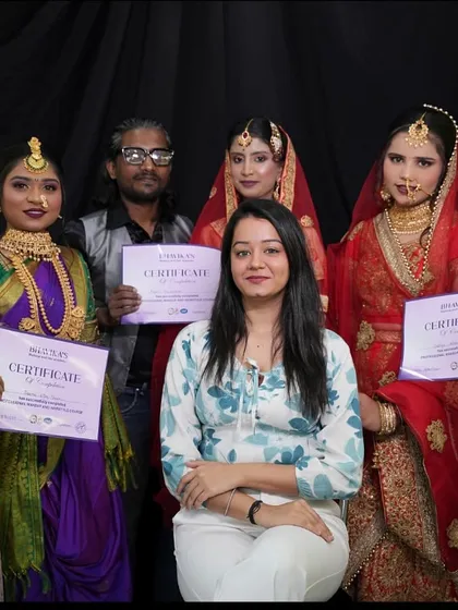 A group photo of me with my students holding their certificates, standing beside their models in full bridal makeup.