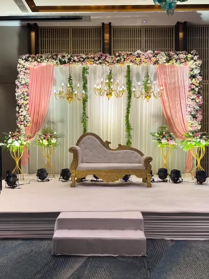 A closer view of the pink and white stage, showing the classic chaise lounge and floral arrangements. This is a perfect example of my elegant event styling.