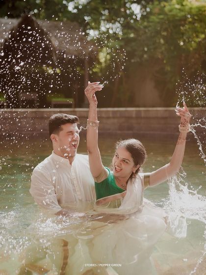 A splash of joy for Jayaram and Abirami during their playful water shoot. These moments of pure fun add so much energy and personality to a pre-wedding film.
