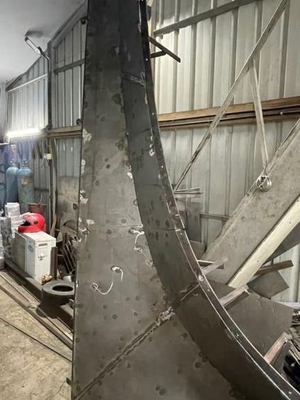 The completed, large-scale metal mould, ready to be transported to the site. Concrete will be poured into this formwork to create the final, fluid balcony edge.