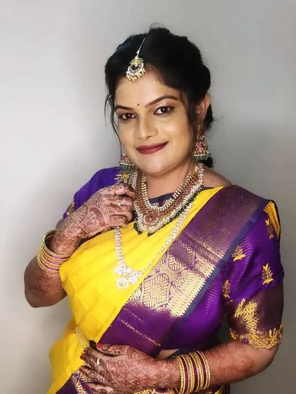 A lovely portrait of Pratima, highlighting her jewelry and the soft, blended makeup.