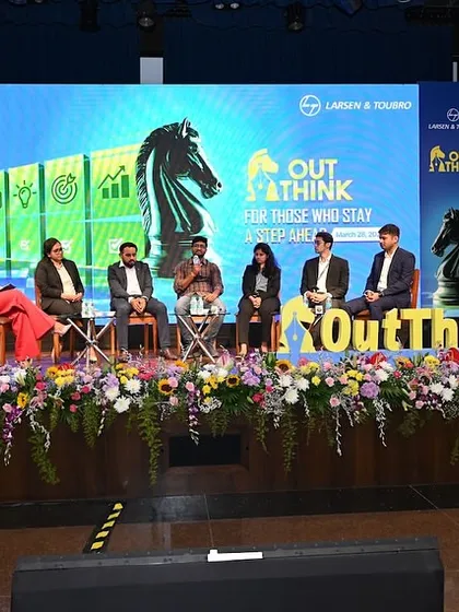 The full panel in discussion at the 'OutThink 2025' event. I take pride in my ability to moderate discussions for major corporations like Larsen & Toubro, covering topics from technology to career progression.