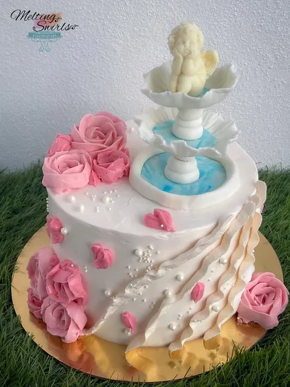 A different view of the elegant fountain cake, showcasing the intricate details and the story of how we overcame challenges to create it for a happy returning client.