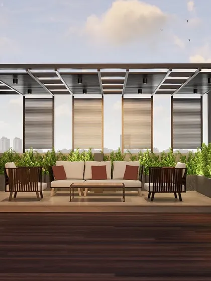 This rooftop terrace in Mangaluru is an urban oasis we designed to blend architecture with nature. A sleek metal pergola provides structure and shade, while the vertical garden wall and rich wooden decking create a lush, biophilic escape from the city below.