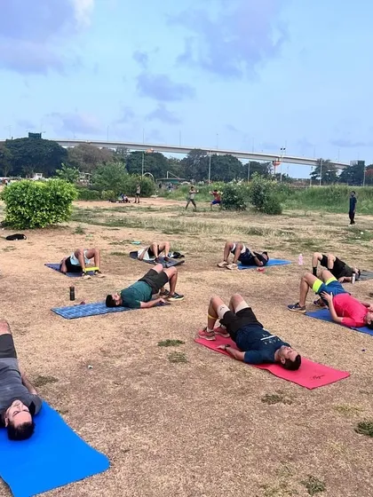 A wide shot of our Mahalaxmi Racecourse group working on glute bridges. The open space allows us to accommodate a large group while ensuring everyone has room to train comfortably.
