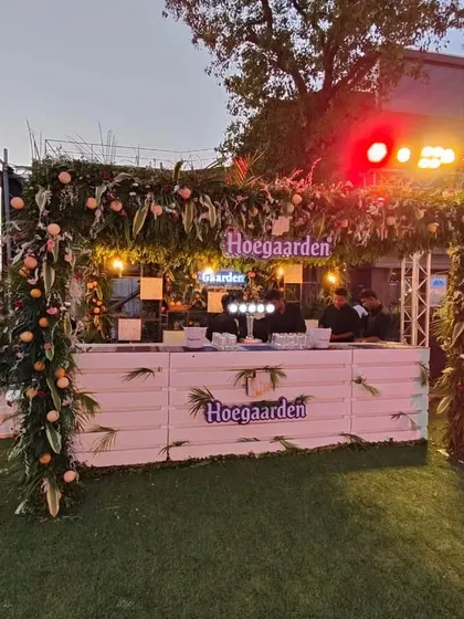 A beautifully decorated Hoegaarden bar we set up for an outdoor event. We can arrange for custom bars and beverage stations that match your party's theme, ensuring the drinks are just as impressive as the food.