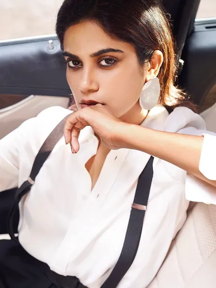 A powerful, androgynous look for Aaditi Pohankar. The slicked-back hair and minimal makeup with a strong brow create a striking, high-fashion statement.