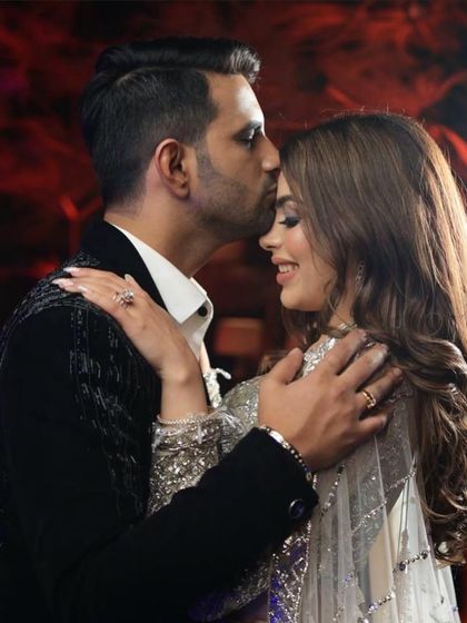 A sweet and romantic moment captured. The bride's soft glam makeup looks beautiful from every angle.