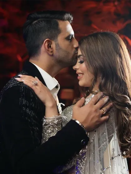 A sweet and romantic moment captured. The bride's soft glam makeup looks beautiful from every angle.