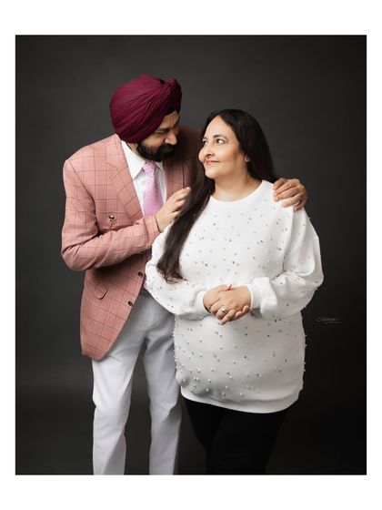 From the giggles to the gentle holds, we captured their love in its most natural form. This sweet maternity couple's portrait is full of warmth.