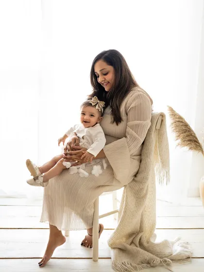 A quiet moment between a mother and her baby girl. The soft, natural light from the studio window creates such a gentle and loving mood.