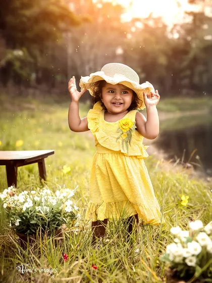 A little ray of sunshine in a field of flowers. This toddler portrait, taken during the golden hour, captures the pure joy of a child playing outdoors.