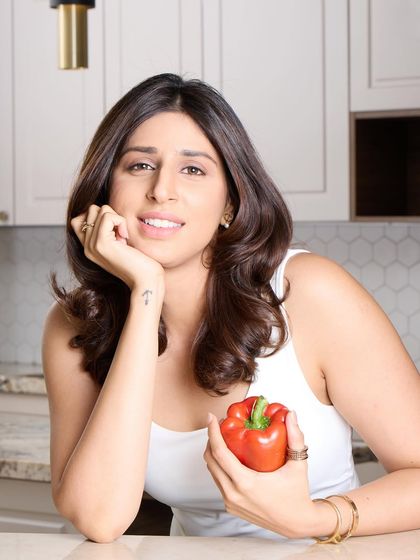 A warm and approachable headshot for the dietitian. This portrait is perfect for her website or social media, instantly connecting with potential clients.