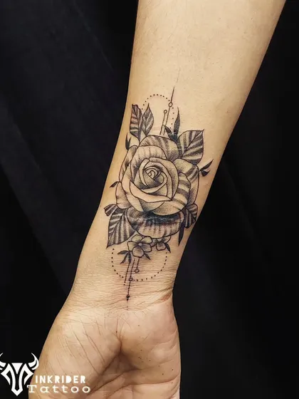A detailed rose tattoo designed specifically to cover a scar on the wrist. We can strategically place designs to work with and conceal skin imperfections.