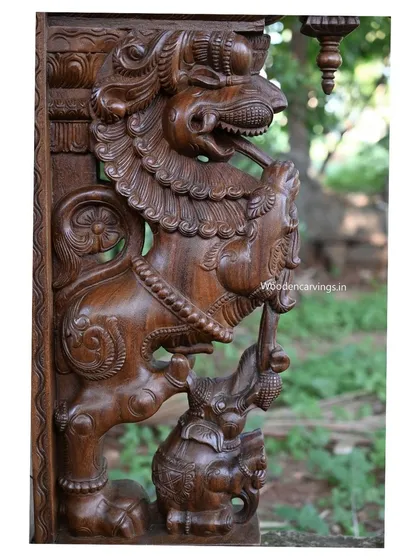 A close-up of the Yaazhi overpowering the elephant. This detail is a powerful symbol of spiritual energy triumphing over earthly strength.
