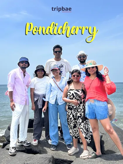 A fun group photo on the rocky promenade of Pondicherry beach. Our trips are designed for making new friends and great pictures.