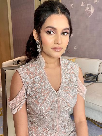 A close-up of the pretty pink eyeshadow and glowing skin.