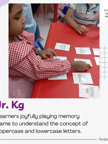 In my Junior KG class, we use fun memory games to help children learn the difference between uppercase and lowercase letters. Here, a student is matching the letter cards, an activity that builds recognition skills through play.