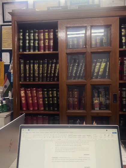 A glimpse into my world. Surrounded by law books and legal drafts, this is where I prepare to fight for my clients. This is my life, and I am dedicated to it.