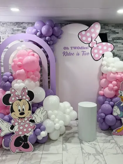 Oh TWOdles! A Minnie Mouse themed second birthday for Khloe. We used shades of pink and purple, with cutouts of Minnie and Daisy Duck, to create a sweet and stylish party.