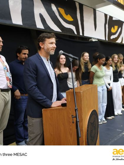 The girls' softball coach celebrates his team's accomplishments during the MESAC awards. We are proud of the growth, teamwork, and friendships forged during each athletic season.