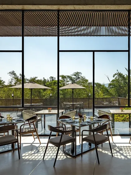 The outdoor dining terrace at the Radisson Resort is an extension of the indoor space, offering guests an opportunity to dine while immersed in the natural beauty of Lonavala.