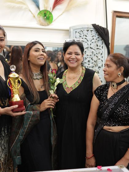 A happy, candid moment with my students and a trophy winner on graduation day.