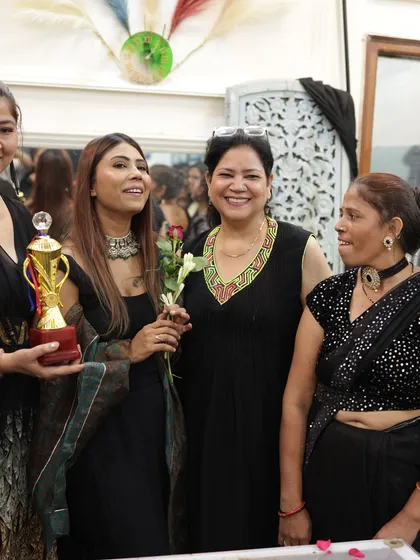 A happy, candid moment with my students and a trophy winner on graduation day.