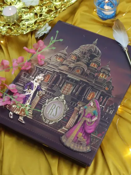 This design captures a palace at dusk, with glowing windows and regal figures. The custom 'RS' monogram adds a personal, luxurious touch.